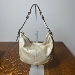 Coach Gold GOAT Leather Hobo Bag with gold tassel